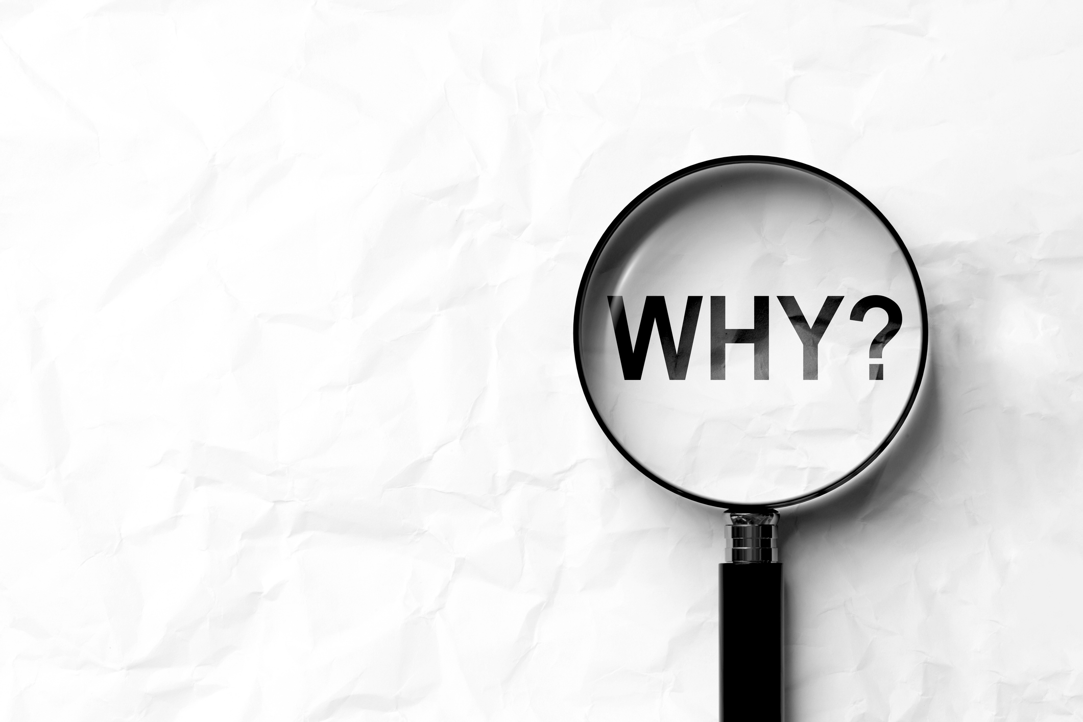 A magnifying glass over the word “WHY?” representing a closer look at what factors influence why house cleaning costs what it does